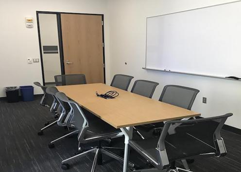 slawson 194. Seats 8 people. Users can plug in laptops for projection to a TV screen